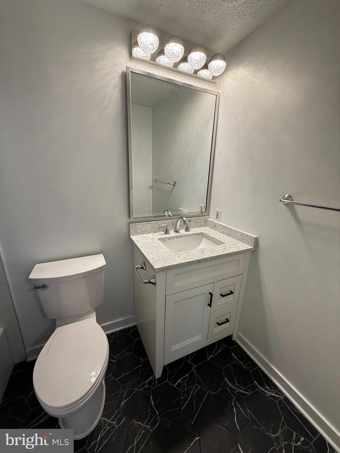 14917 Lear Lane Silver Spring, MD 20905 - Photo 17 of 49 a bathroom with a sink toilet and mirror
