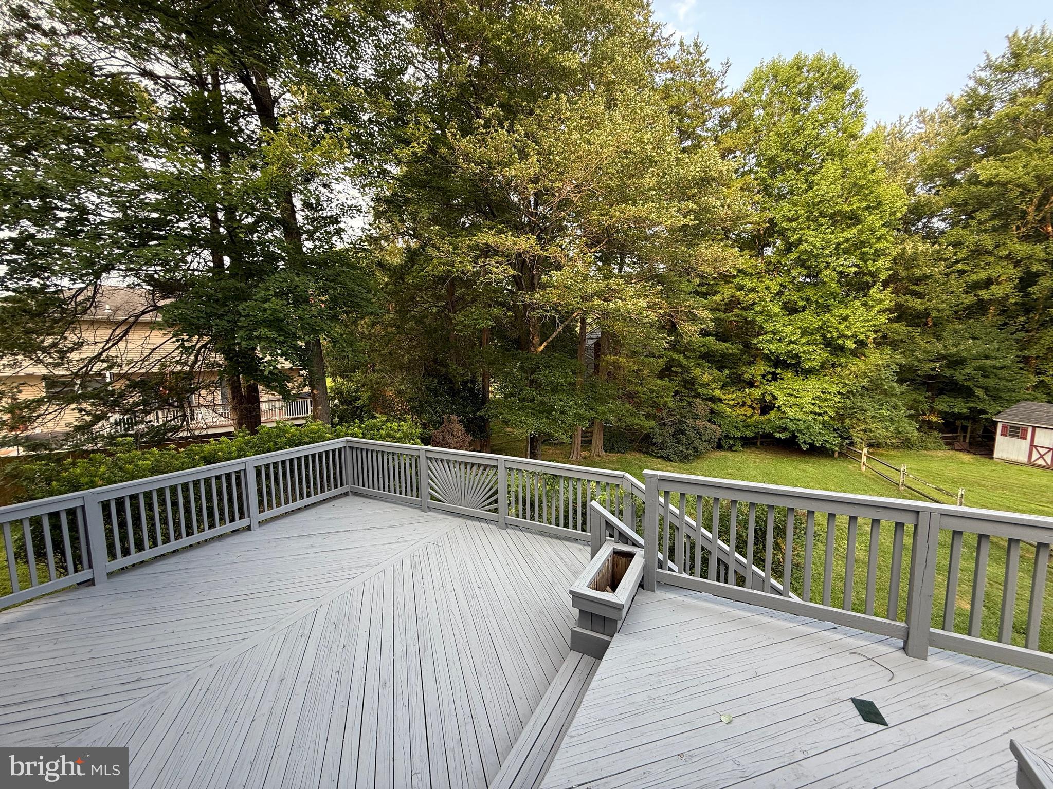 14917 Lear Lane Silver Spring, MD 20905 - Photo 34 of 49 a view of balcony with wooden floor and fence