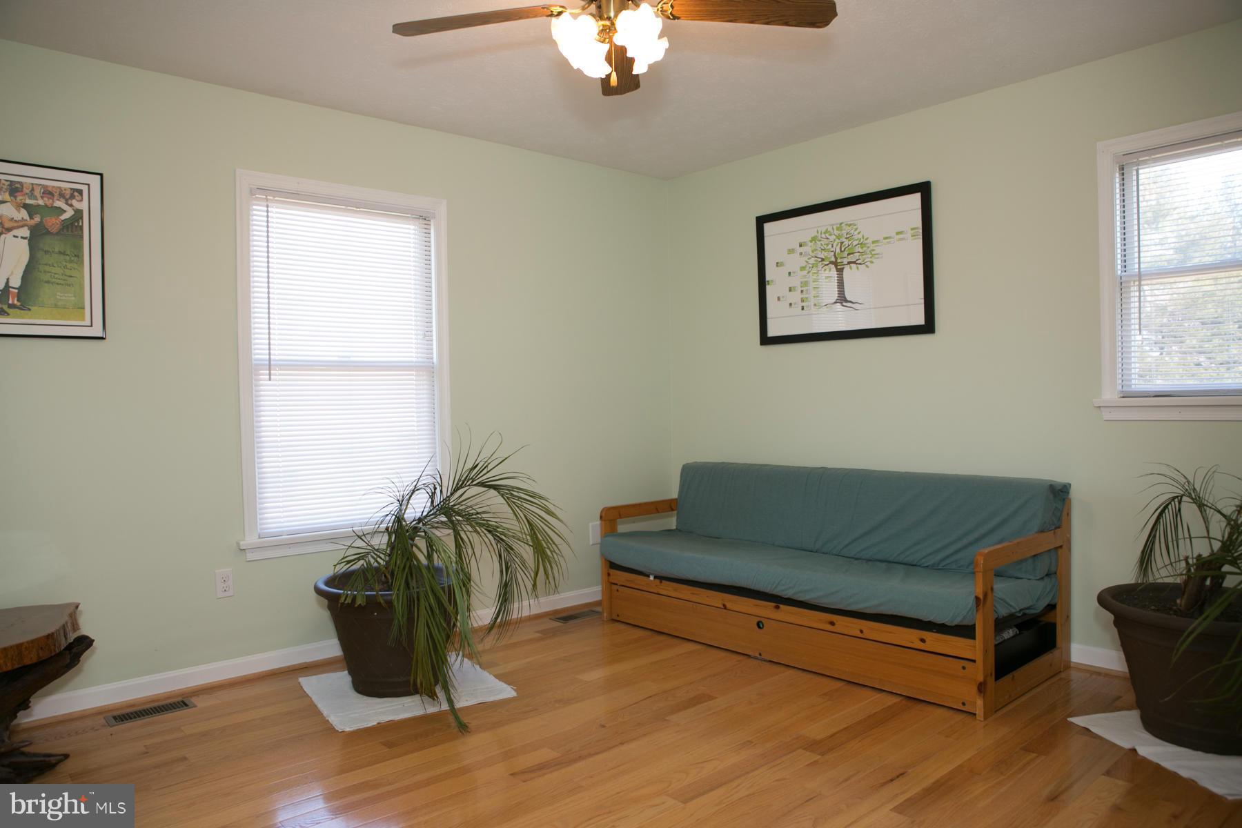 17609 Troyer Road White Hall, MD 21161 - Photo 14 of 30 a living room with furniture and a window