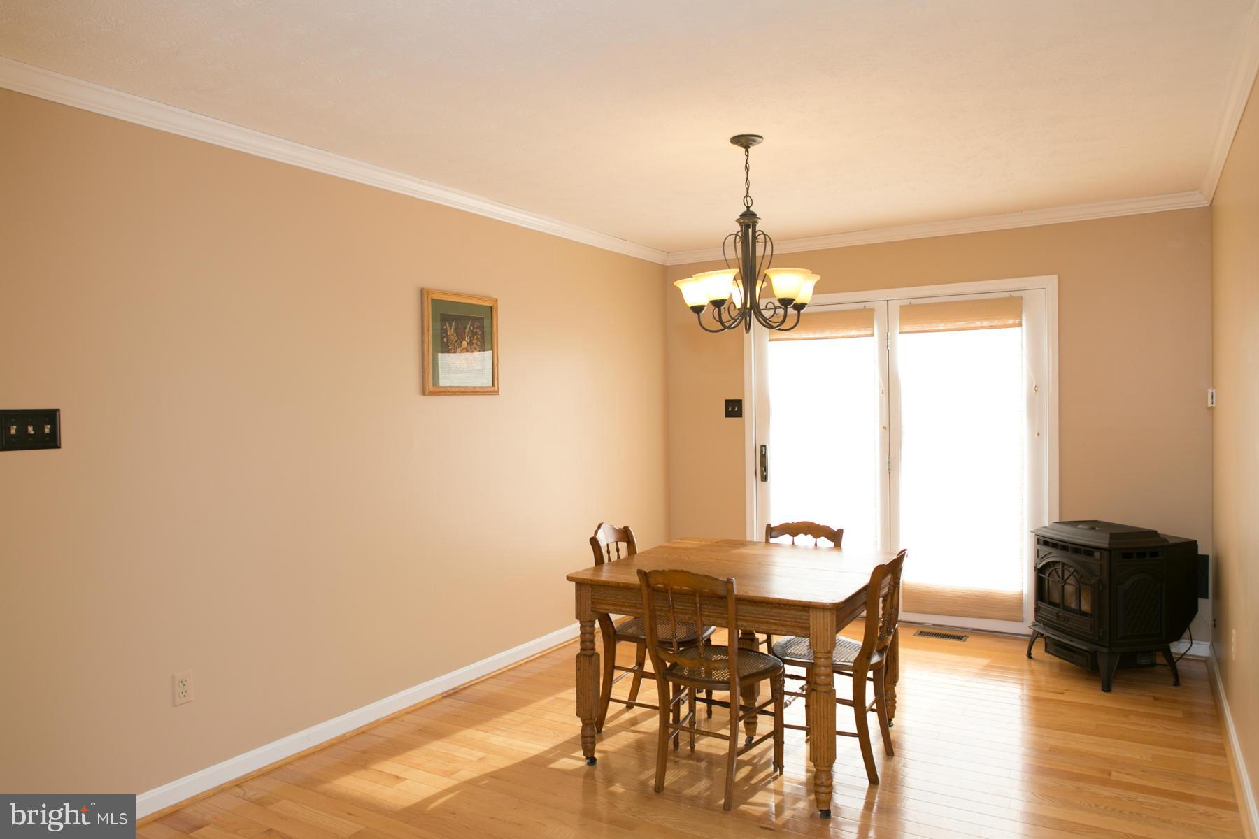 17609 Troyer Road White Hall, MD 21161 - Photo 5 of 30 a dining room with furniture and wooden floor