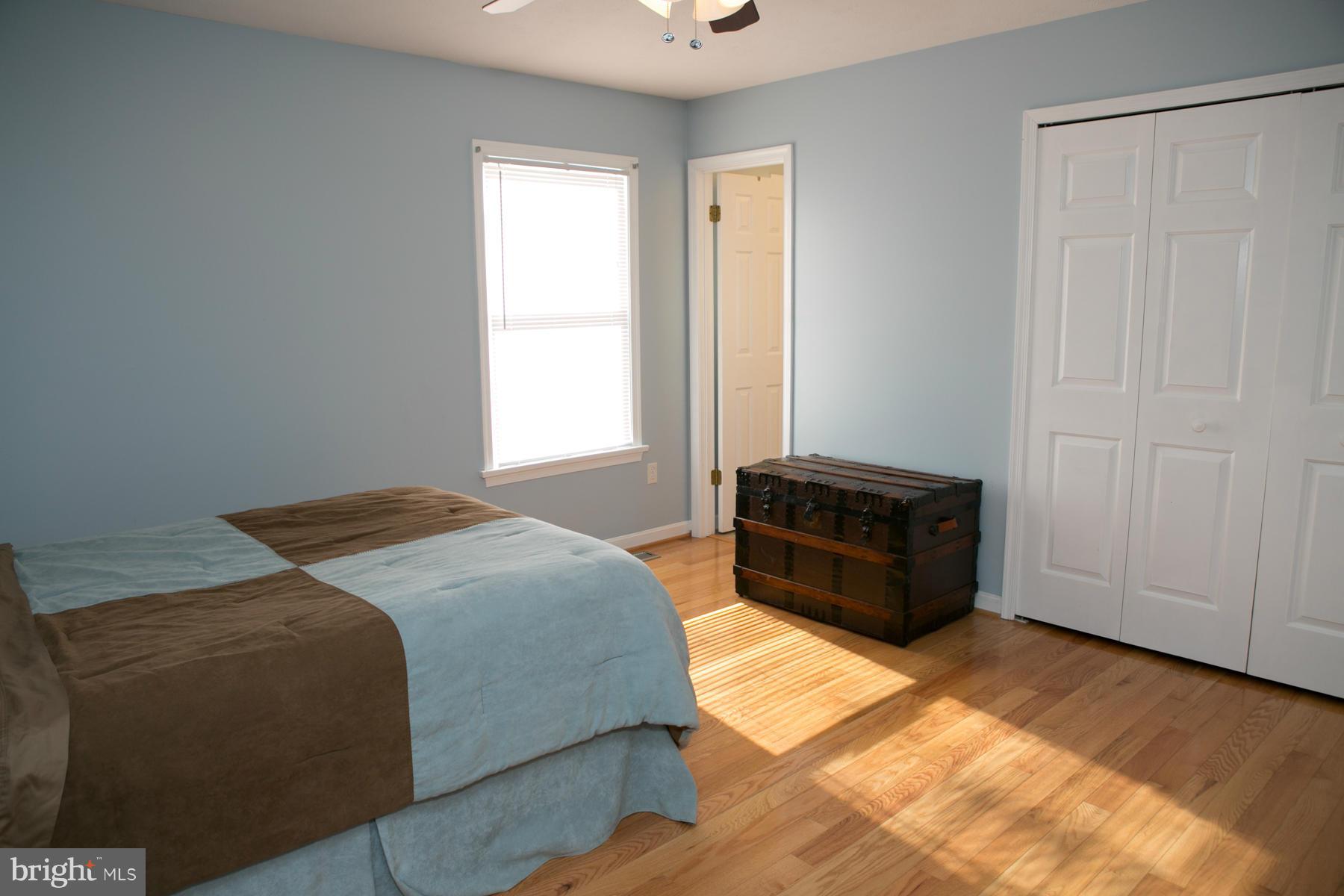 17609 Troyer Road White Hall, MD 21161 - Photo 8 of 30 a bedroom with a bed and a window