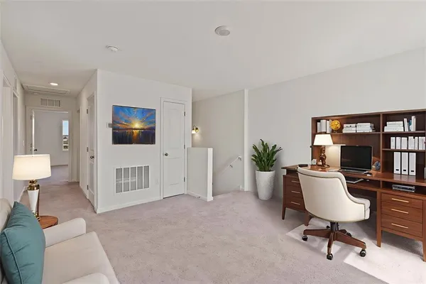 a living room with furniture and a rug
