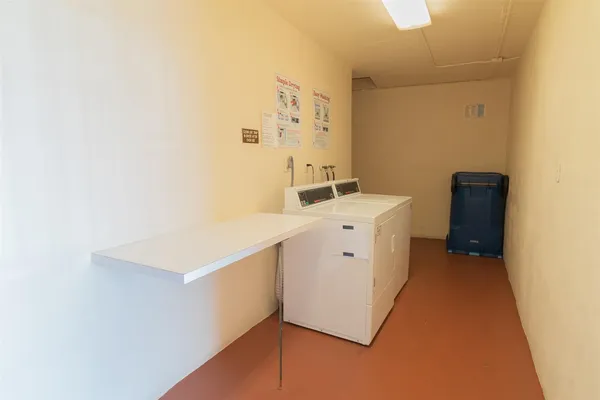 a view of a hallway with a door