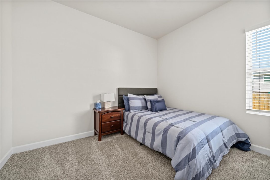 106 Purcell Way Easley, SC 29642 - Photo 32 of 39 This cozy bedroom offers a tranquil retreat with soft carpet and natural light from the window.
