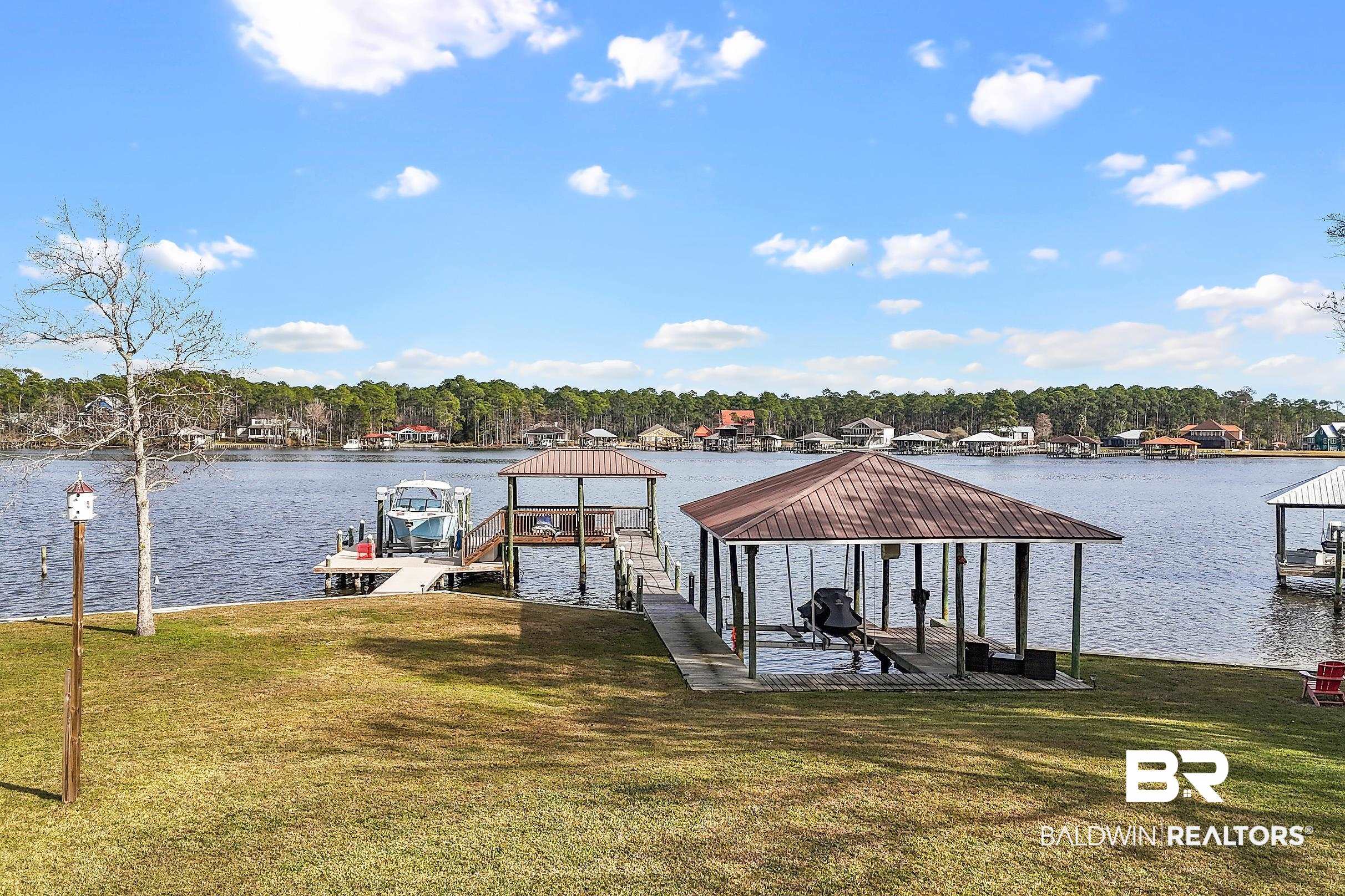 8490 Bay View Drive Foley, AL 36535 - Photo 5 of 67 Dock area featuring boat lift, a yard, and a water view