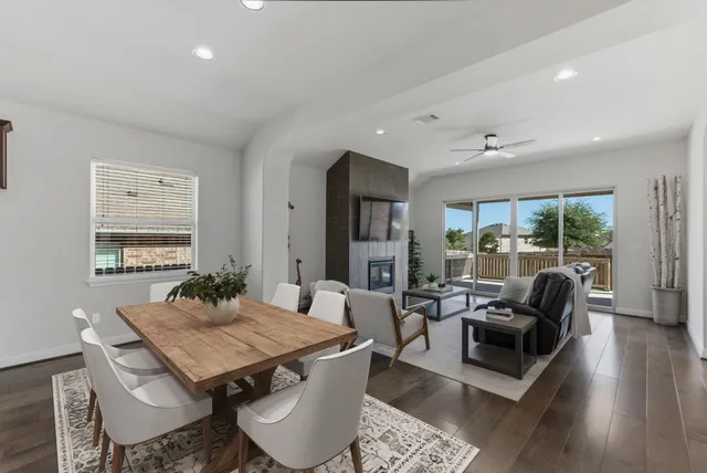 a view of a dining room with furniture window and wooden floor
