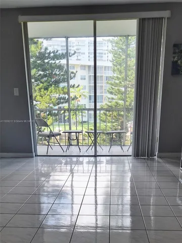 a view of a room with windows and mountain view