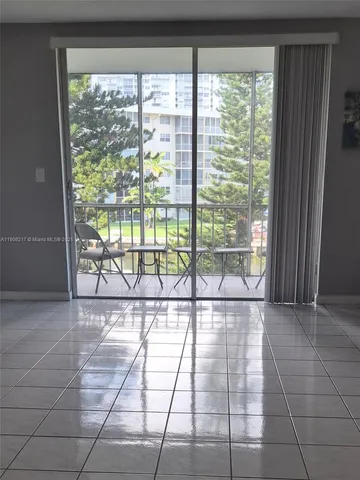 a view of a room with a large window