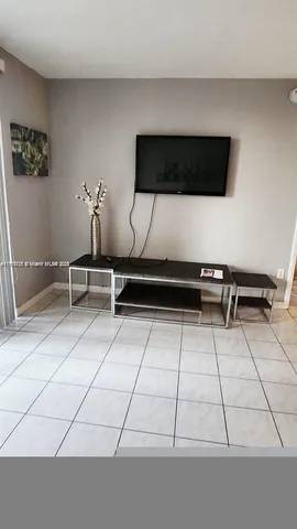 a living room with gym equipment