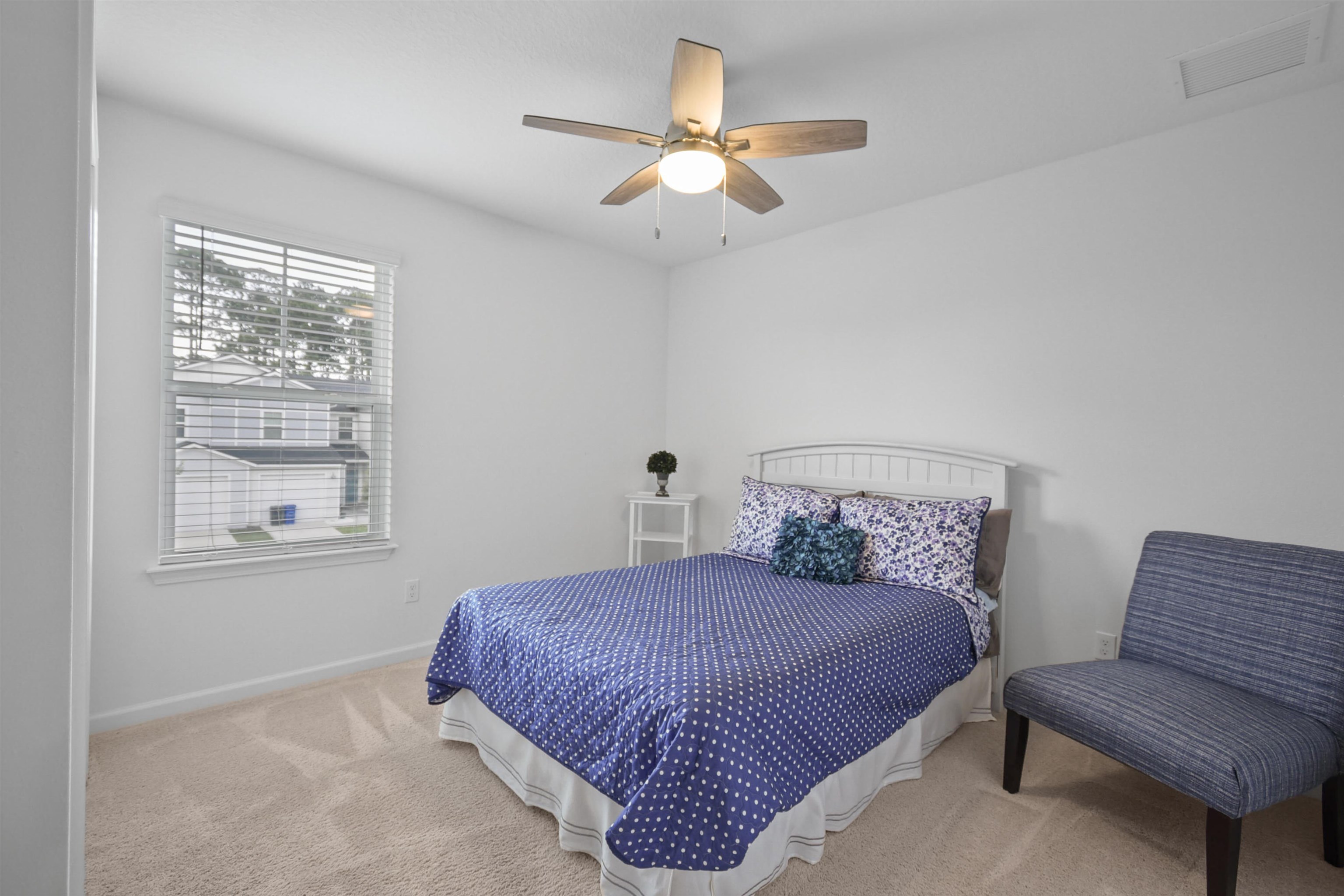 105 Ridge Lake Road St. Augustine, FL 32086 - Photo 25 of 34 a bedroom with a bed two couch and a window