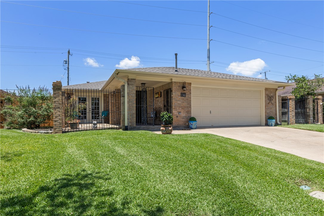 2911 Braeburn Street Bryan, TX 77802 - Photo 1 of 30 Covered Entry and Patio Area with nice front yard. New Roof in 2025.