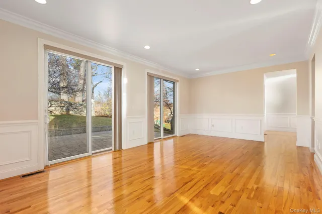 a view of a kitchen with wooden floor and a kitchen