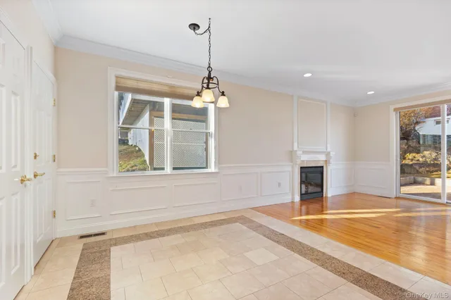 a view of a living room and kitchen with a large window