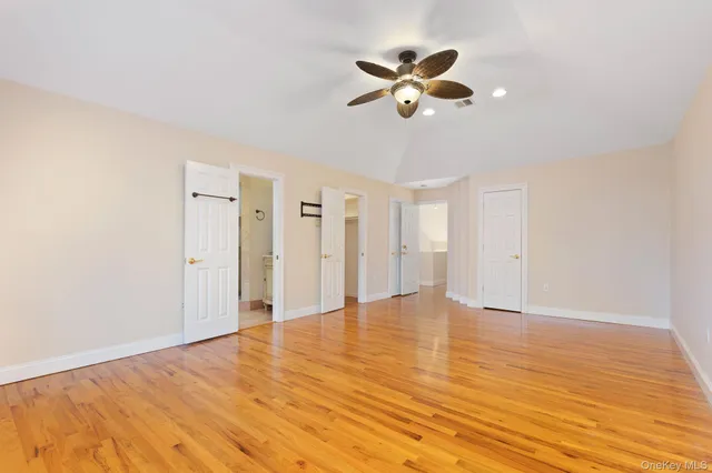 a bathroom with a tub sink toilet and a window