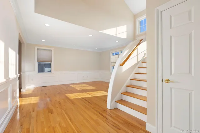 a view of entryway with wooden floor
