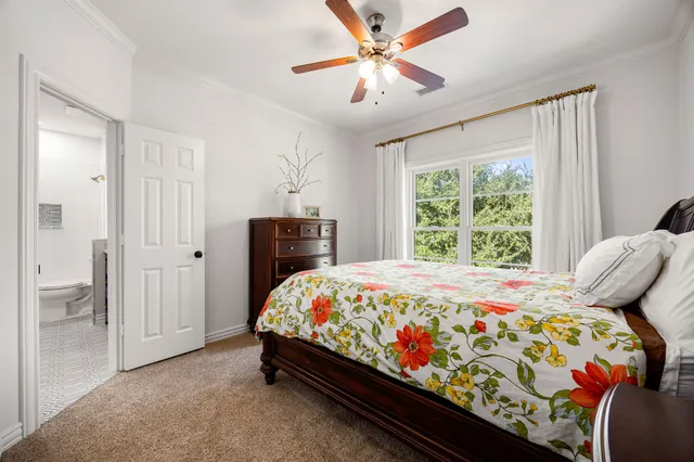 a bathroom with a toilet a sink and a mirror