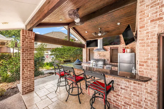 a living room with furniture a rug and a chandelier