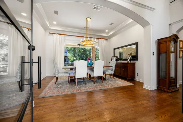 a kitchen with kitchen island granite countertop a sink appliances and cabinets