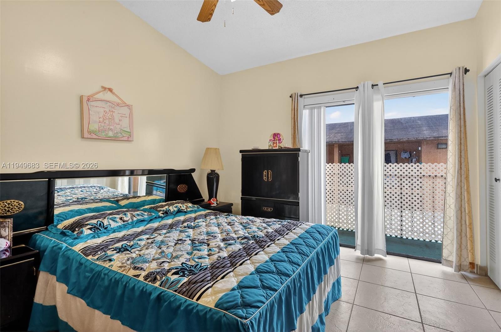 2224 West 53rd Place, Unit 2224 Hialeah, FL 33016 - Photo 17 of 27 a bedroom with a bed and a dresser