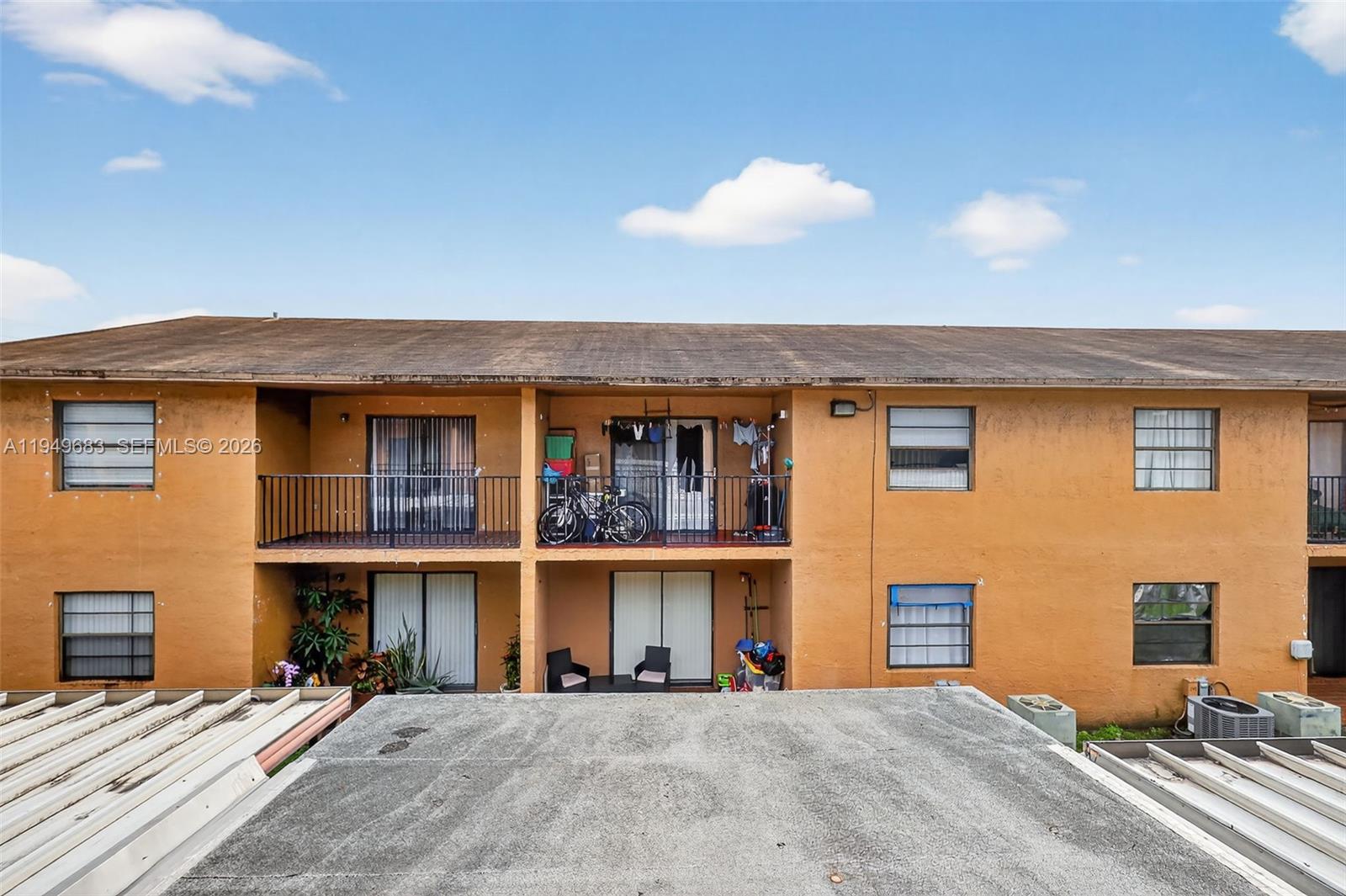 2224 West 53rd Place, Unit 2224 Hialeah, FL 33016 - Photo 22 of 27 a view of a house with many windows