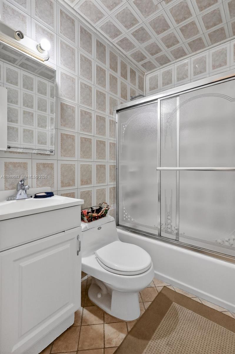 2224 West 53rd Place, Unit 2224 Hialeah, FL 33016 - Photo 25 of 27 a bathroom with a toilet and a shower