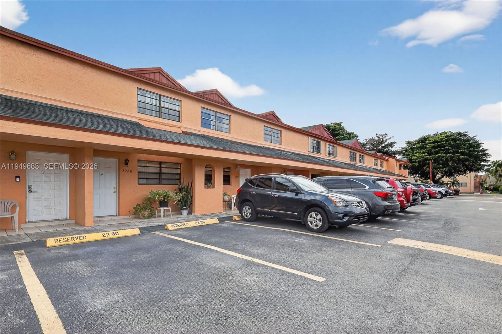 2224 West 53rd Place, Unit 2224 Hialeah, FL 33016 - Photo 3 of 27 a car parked in front of a building