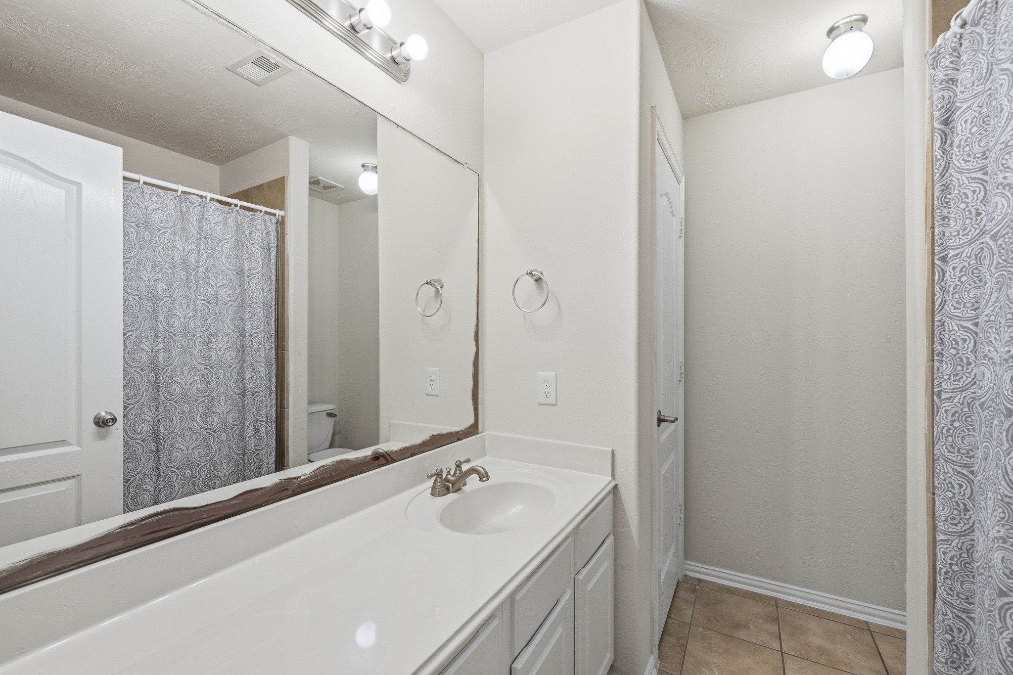 2117 Rushing Spring Drive Pearland, TX 77584 - Photo 37 of 42 Discover convenience and style in the spacious full bathroom located on the second floor, featuring modern fixtures and ample space for relaxation.