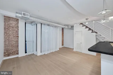 a view of a room with a staircase