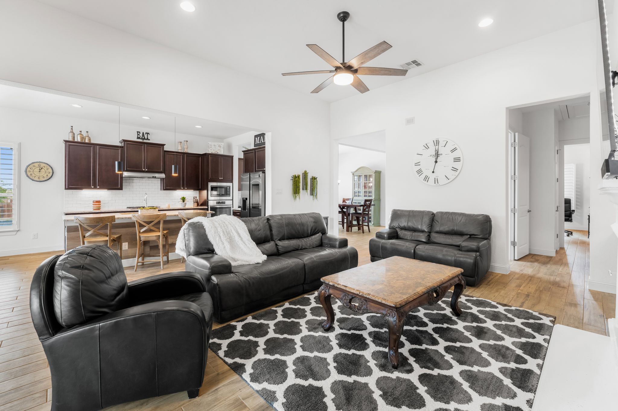 140 Waterloo Cove Georgetown, TX 78628 - Photo 16 of 40 An open concept design seamlessly connects the living room to the chef's kitchen, fostering an inviting atmosphere.