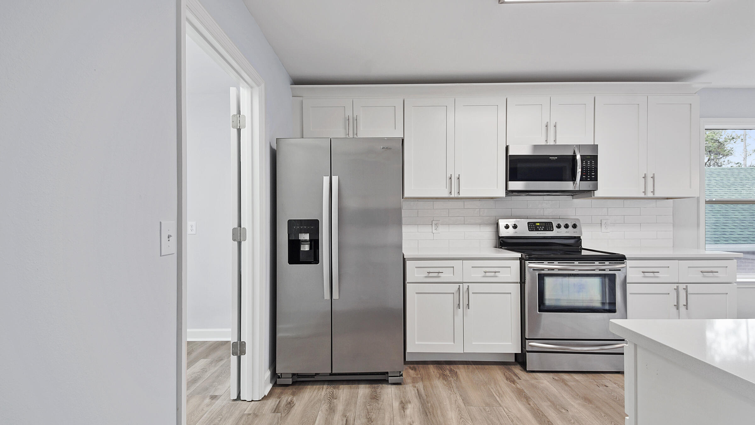 1190 Bay Court Destin, FL 32541 - Photo 12 of 52 a kitchen with stainless steel appliances granite countertop a stove a refrigerator and a microwave
