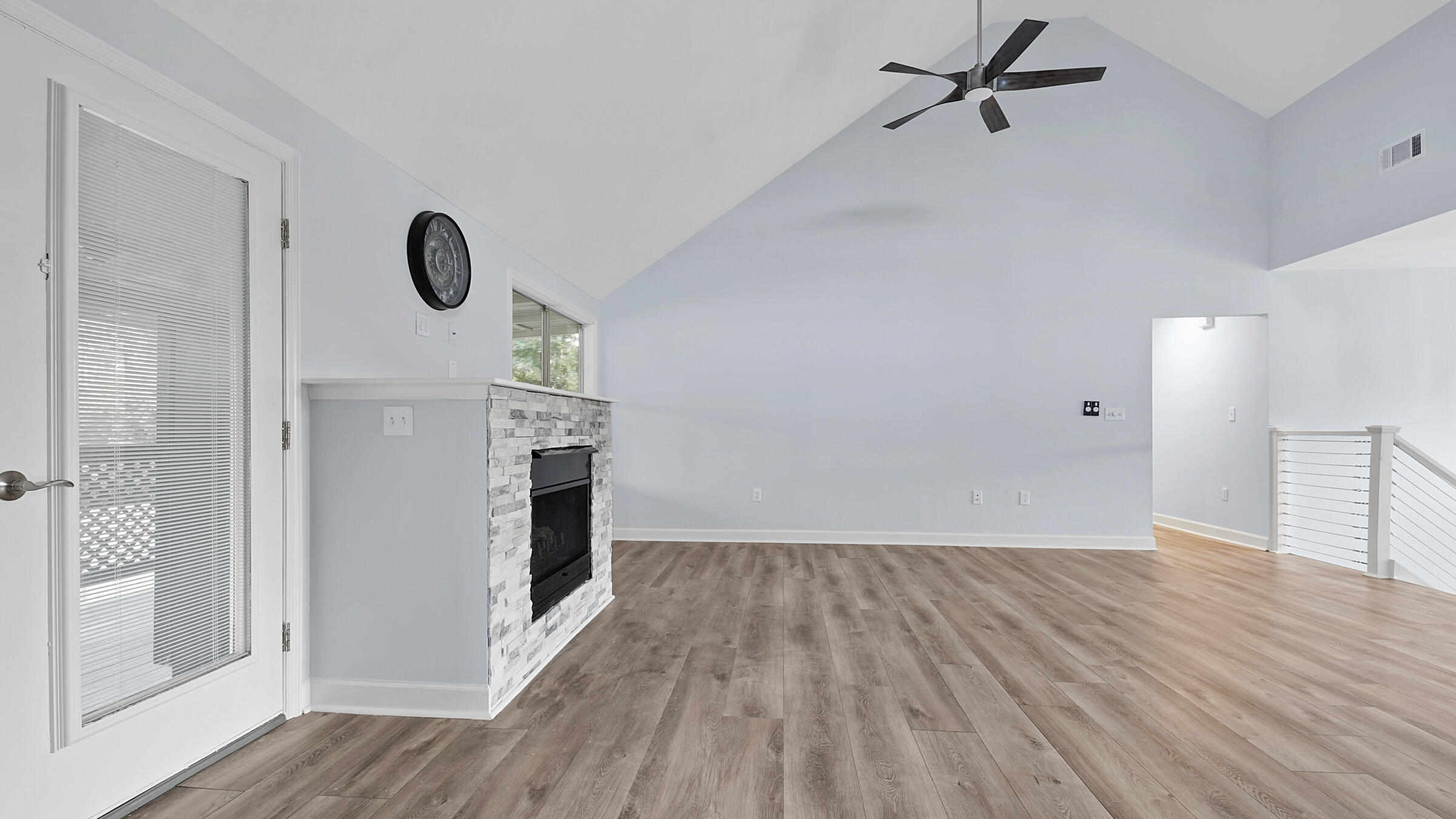 1190 Bay Court Destin, FL 32541 - Photo 18 of 52 an empty room with wooden floor cabinet and windows