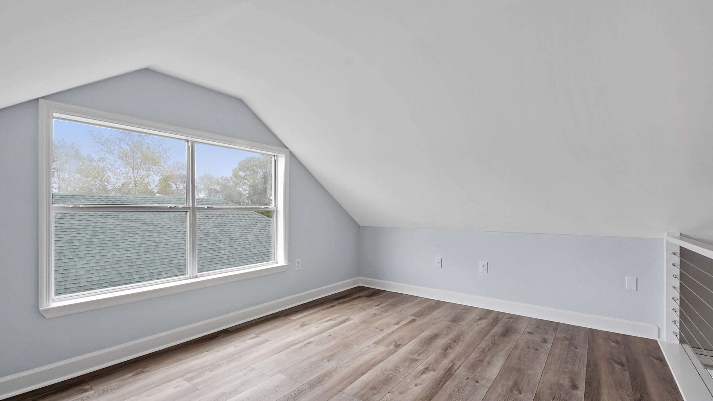 1190 Bay Court Destin, FL 32541 - Photo 23 of 52 an empty room with wooden floor and windows