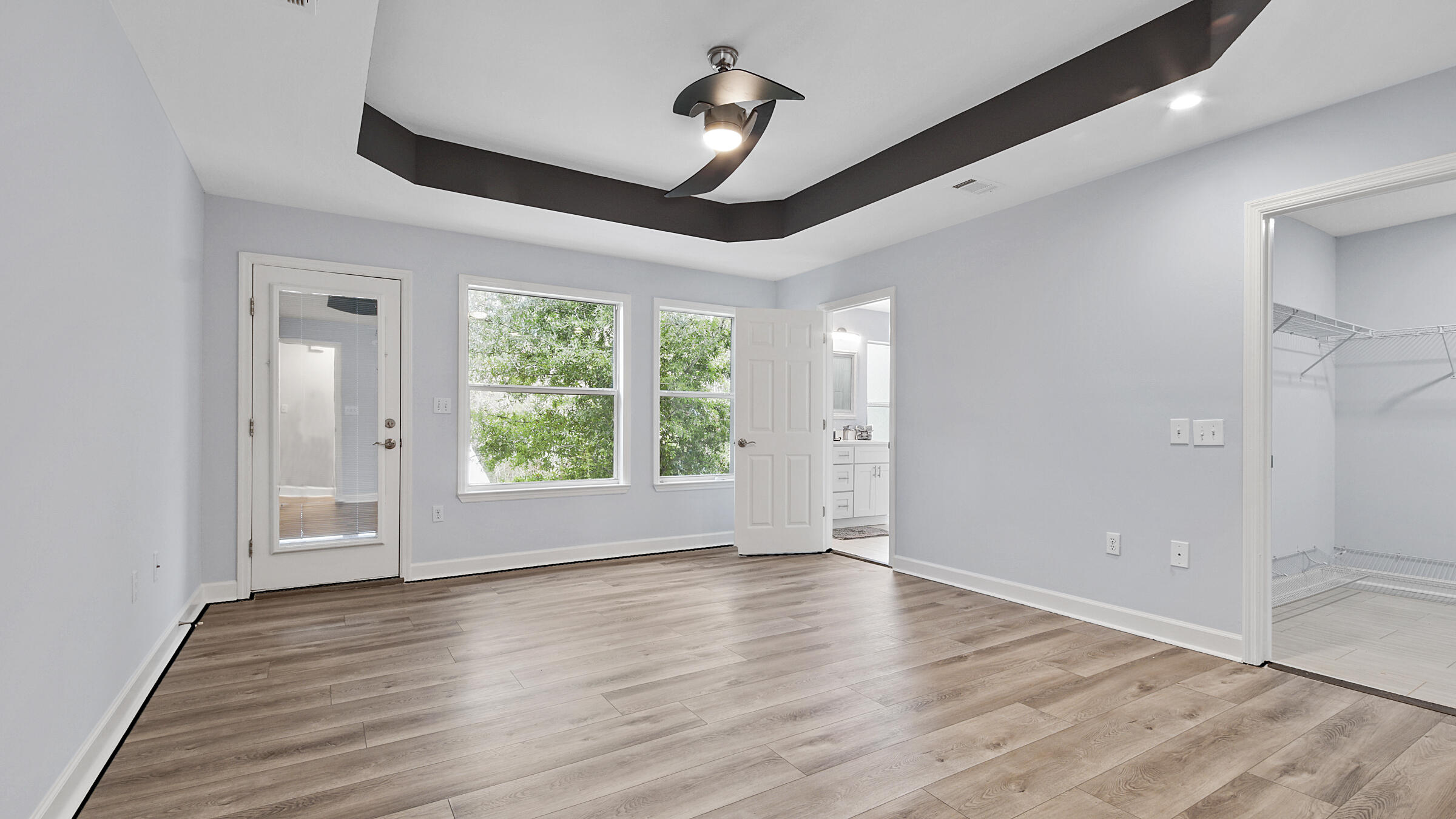 1190 Bay Court Destin, FL 32541 - Photo 25 of 52 a view of empty room with wooden floor and fan