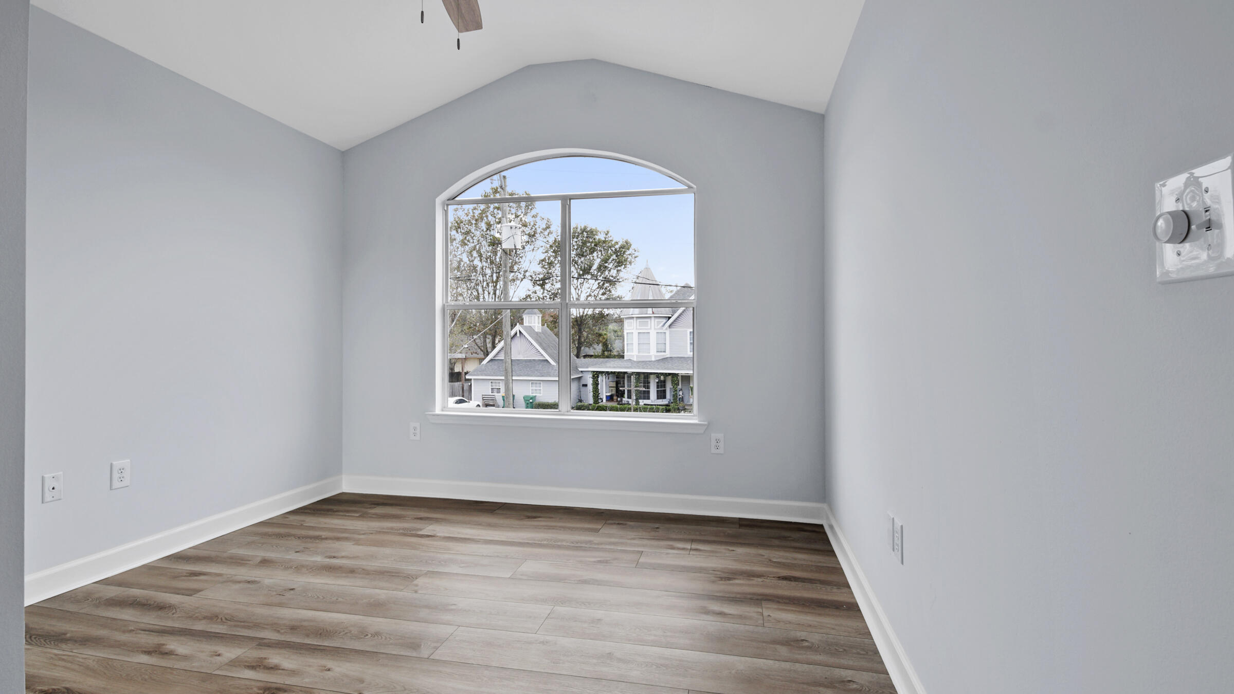 1190 Bay Court Destin, FL 32541 - Photo 34 of 52 an empty room with wooden floor a ceiling fan and window
