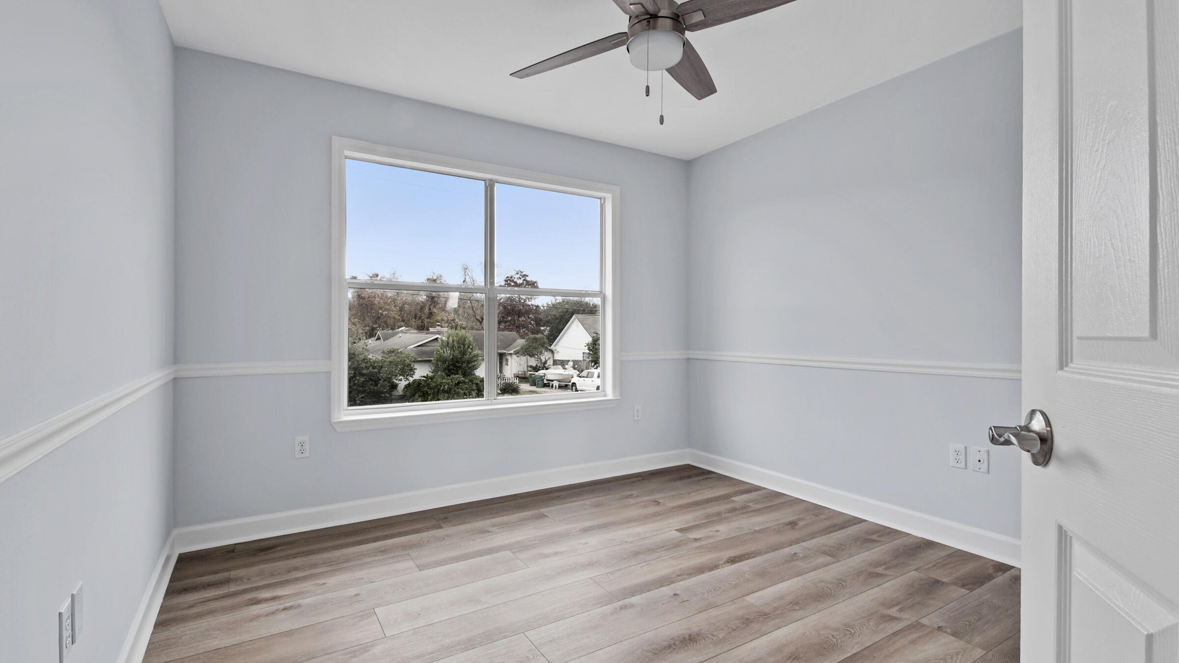 1190 Bay Court Destin, FL 32541 - Photo 35 of 52 wooden floor in an empty room with a window