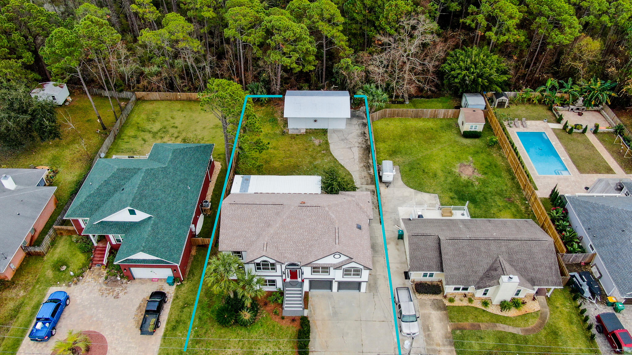 1190 Bay Court Destin, FL 32541 - Photo 41 of 52 aerial view of a house with swimming pool and large trees