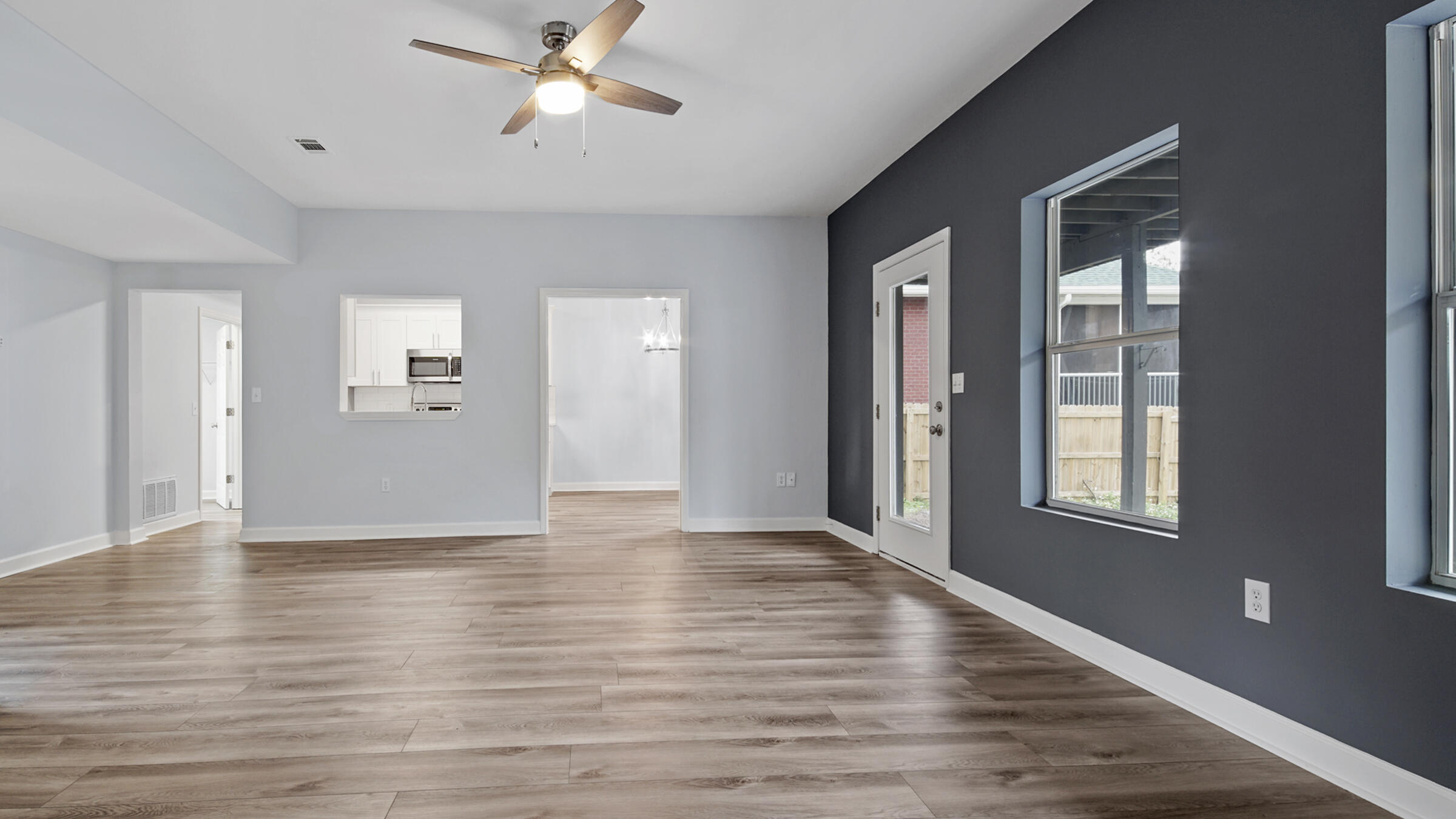1190 Bay Court Destin, FL 32541 - Photo 42 of 52 a view of an empty room with wooden floor and a window