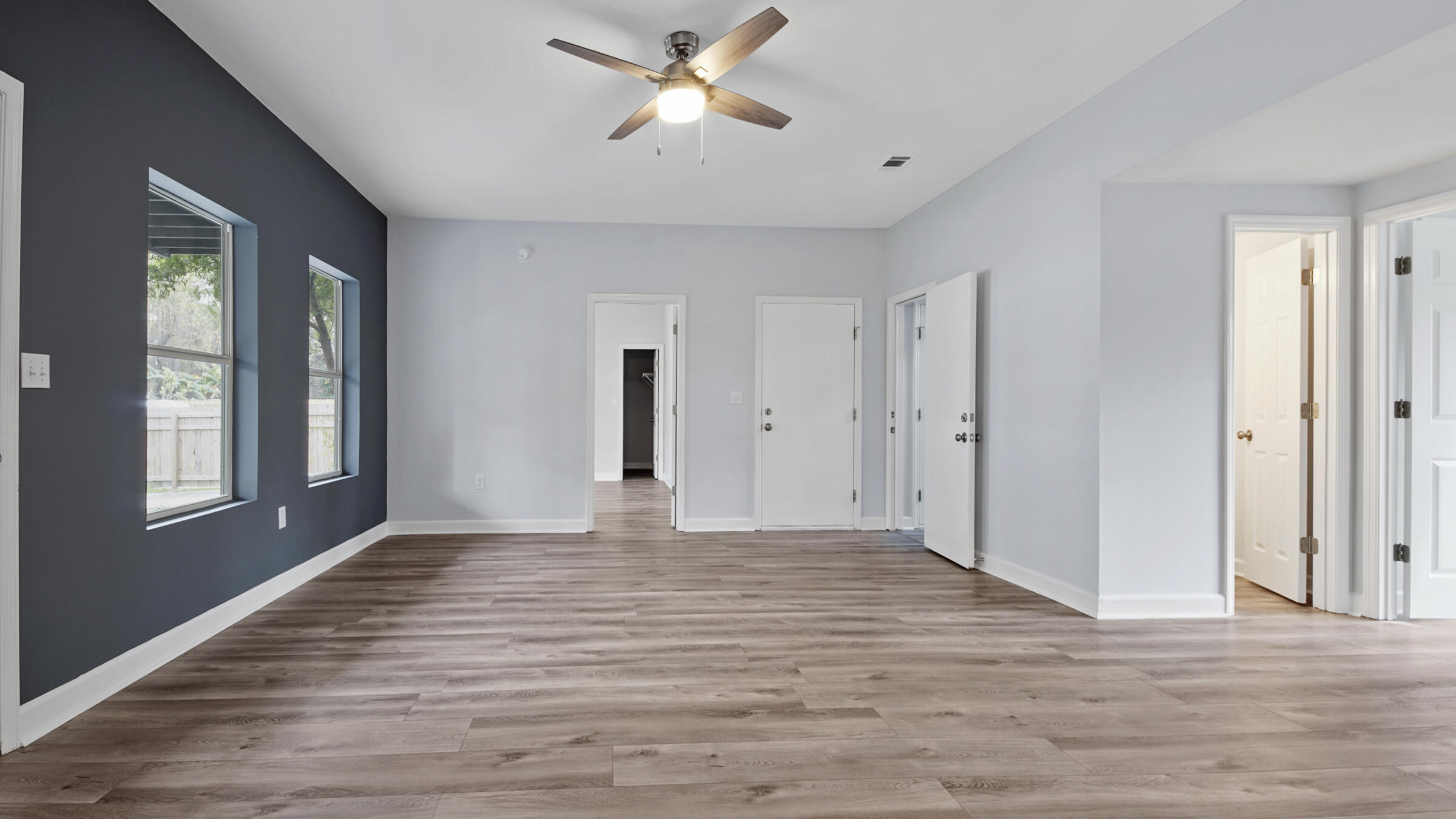 1190 Bay Court Destin, FL 32541 - Photo 44 of 52 a view of empty room with wooden floor and fan