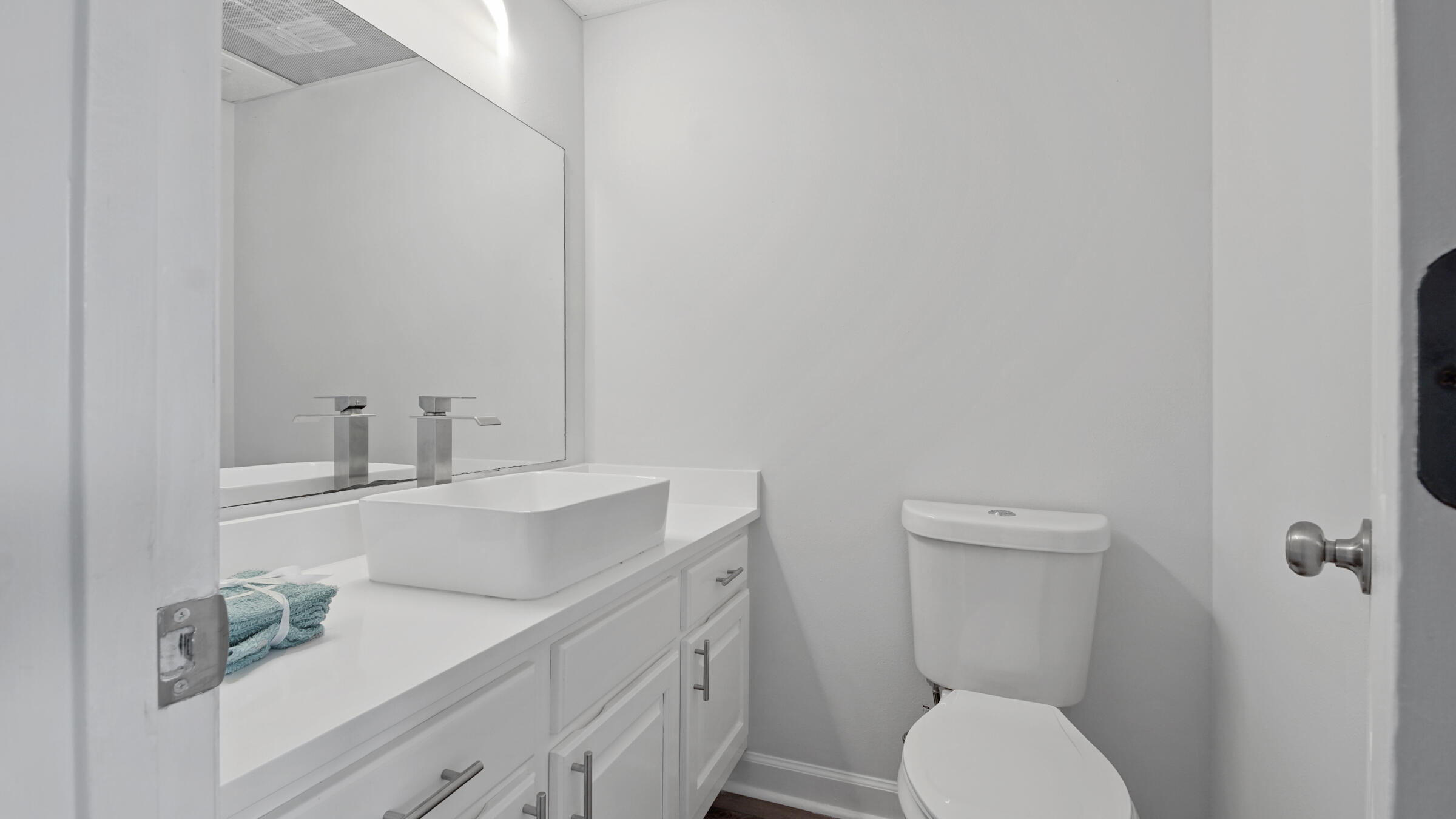 1190 Bay Court Destin, FL 32541 - Photo 48 of 52 a bathroom with a sink mirror vanity and toilet