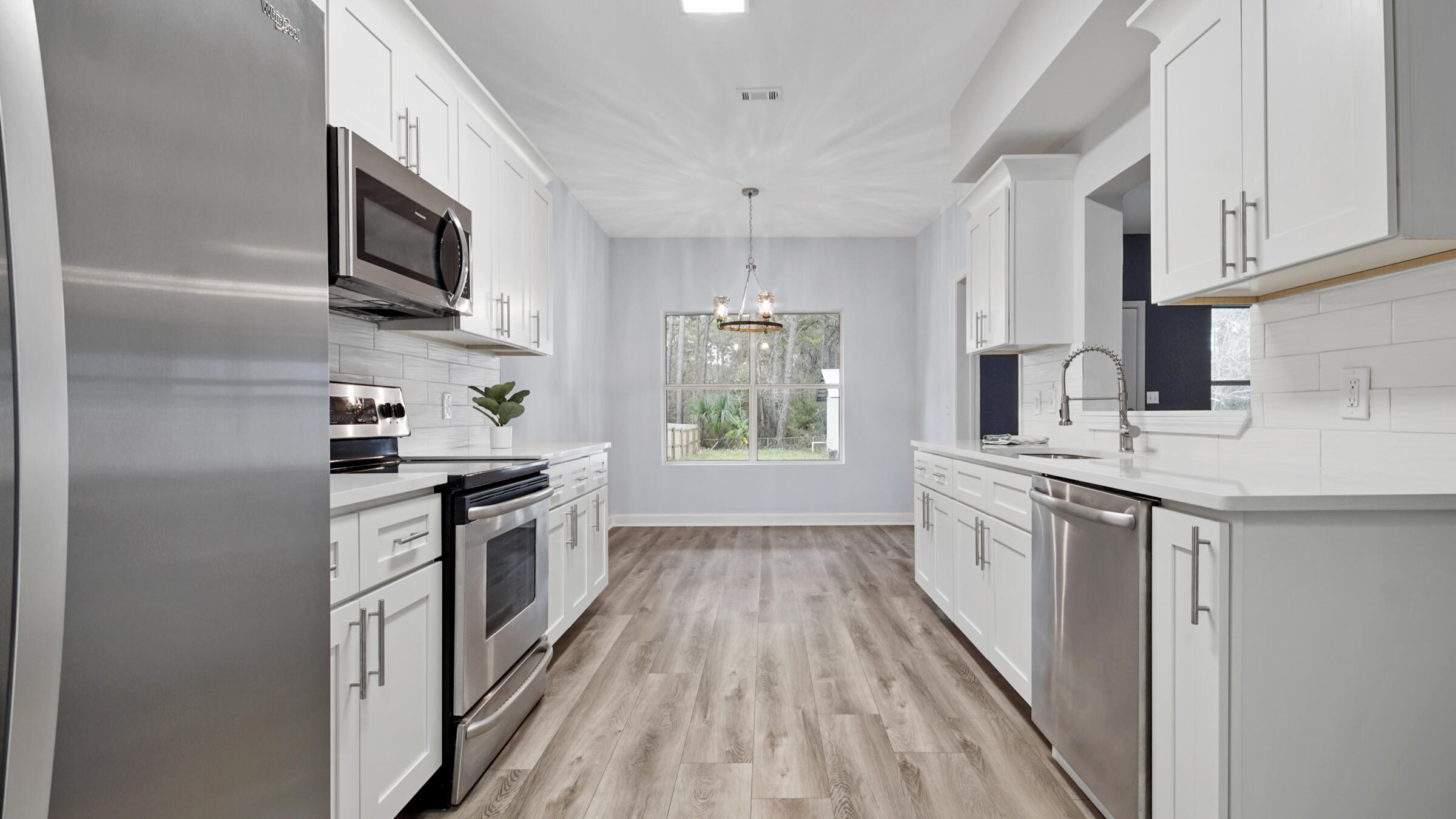 1190 Bay Court Destin, FL 32541 - Photo 51 of 52 a kitchen with stainless steel appliances granite countertop a stove a sink dishwasher and a refrigerator