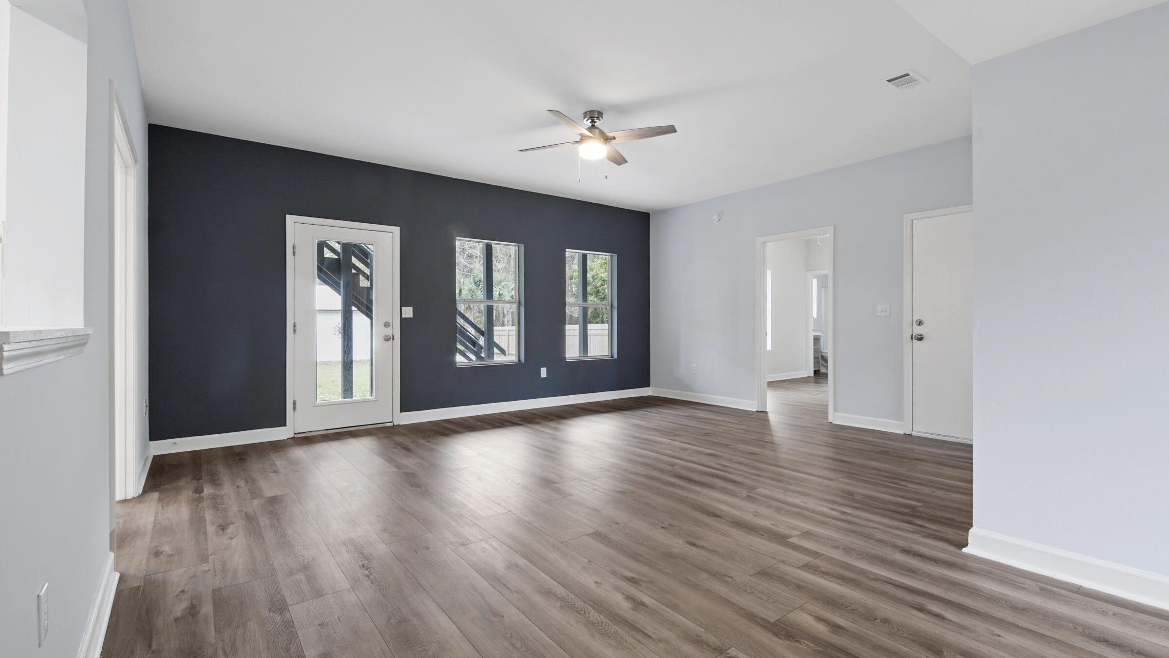 1190 Bay Court Destin, FL 32541 - Photo 52 of 52 a view of an empty room with wooden floor and a window