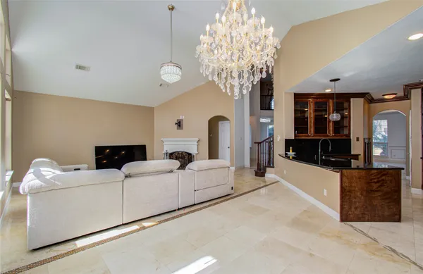 a living room with furniture and large windows