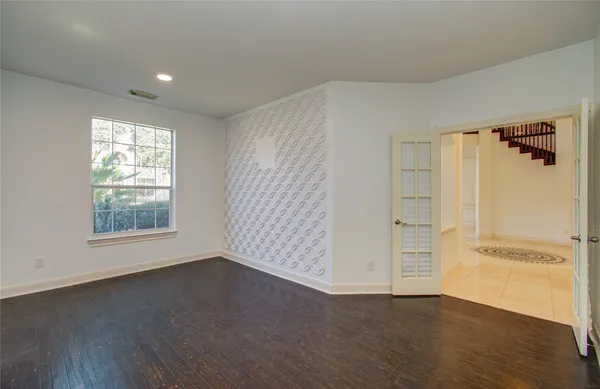 a spacious bathroom with a bathtub and a sink