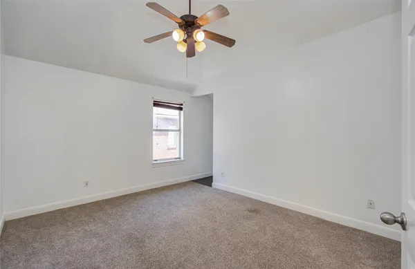 a bathroom with a granite countertop sink a mirror and shower