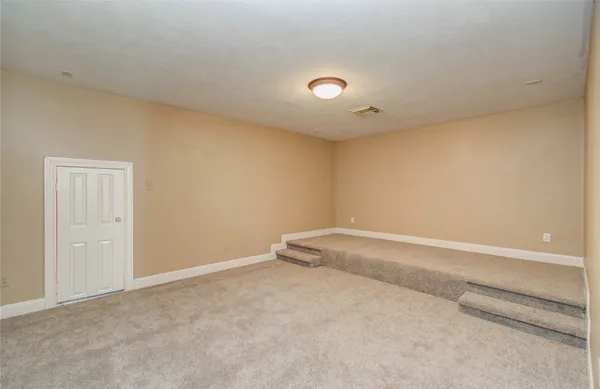 a view of house with swimming pool outdoor seating