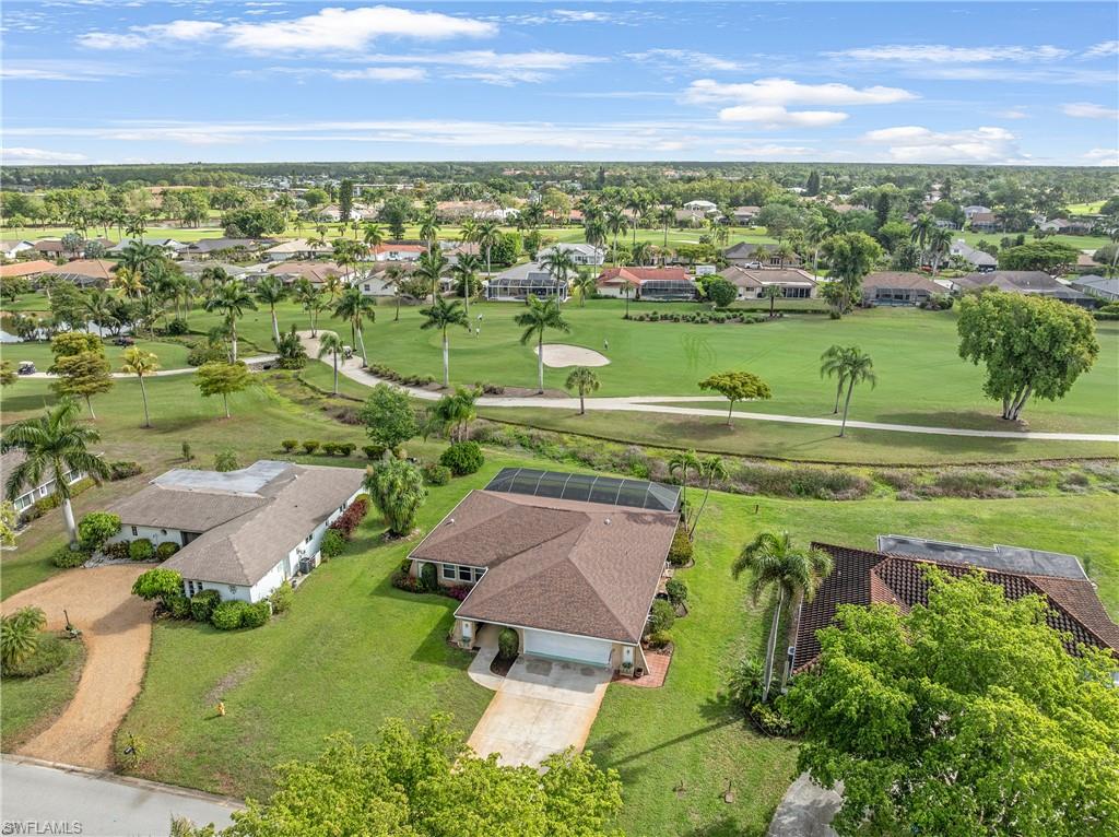 313 Forest Hills Boulevard Naples, FL 34113 - Photo 6 of 14 an aerial view of a houses with outdoor space and a lake view