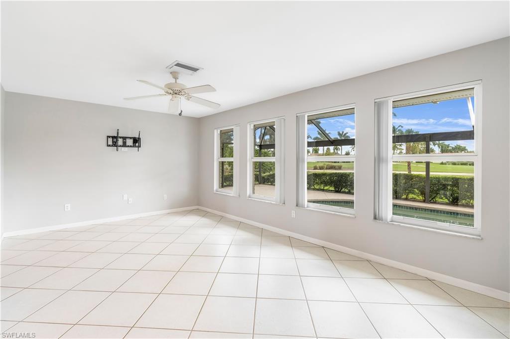 313 Forest Hills Boulevard Naples, FL 34113 - Photo 9 of 14 a view of an empty room with a window