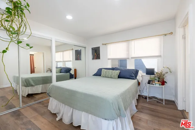 a bedroom with a bed and a chair