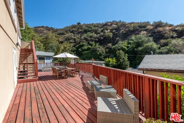 a view of balcony with furniture