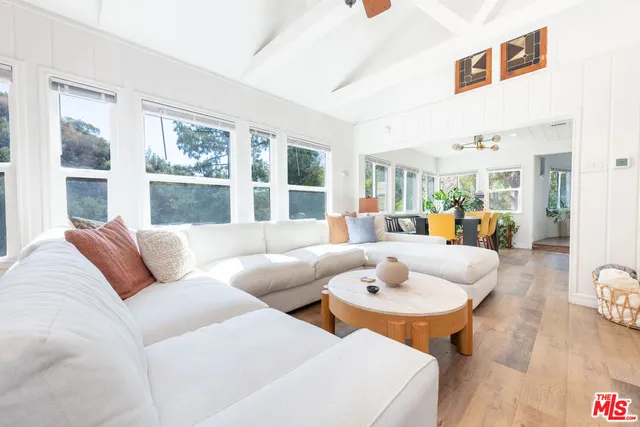 a living room with furniture and a table